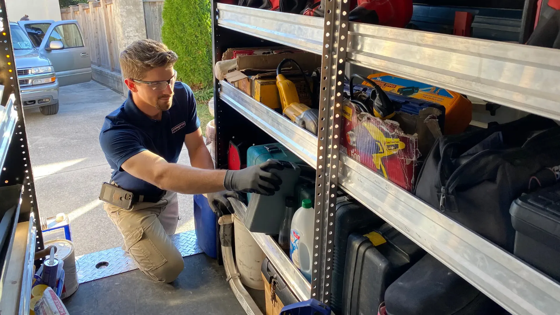 CrewPros employee grabbing tools.