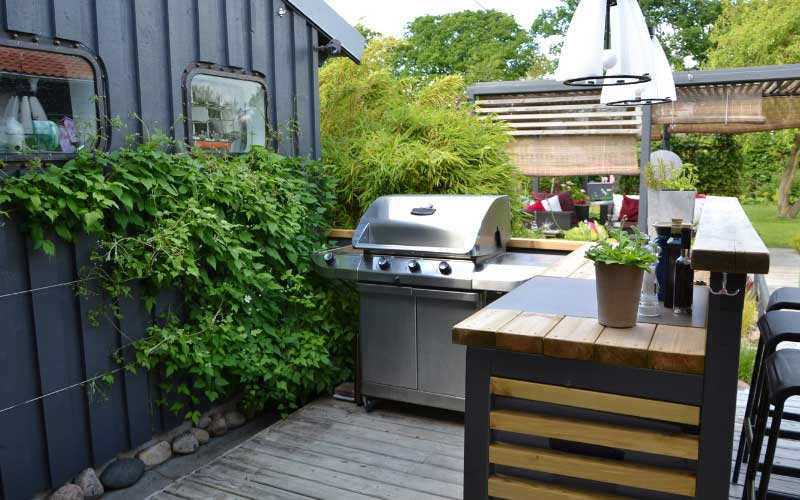 Outdoor kitchen with a grill.