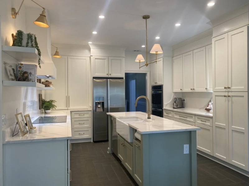 A modern kitchen with clean lines and soft color cabinets.