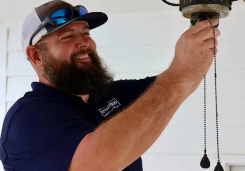 CrewPros employee changing a fixture.